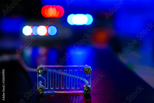 Organ-on-a-chip (OOC) - microfluidic device chip that simulates biological organs that is type of artificial organ. Prototype of design lab-on-a-chip in microfluidic laboratory photo