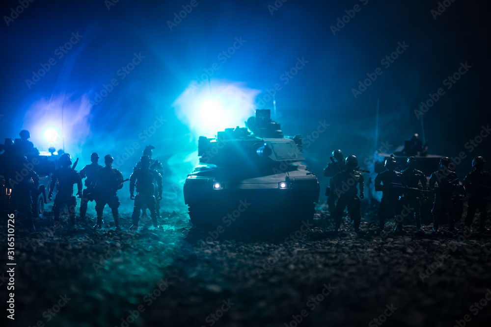 Military patrol car on sunset background. Army war concept. Silhouette of armored vehicle with soldiers ready to attack. Artwork decoration. Selective focus Military patrol car on sunset background. Army war concept. Silhouette of armored vehicle with soldiers ready to attack. Artwork decoration. Selective focus