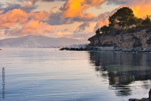 Sunset on the Mediterranean Sea with Still Water and Reflections