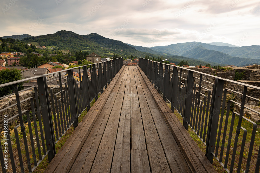 wooden path at the castle in Berceto town, Province of Parma, Emilia-Romagna, Italy