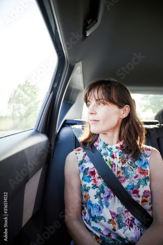 happy woman traveling in a car
