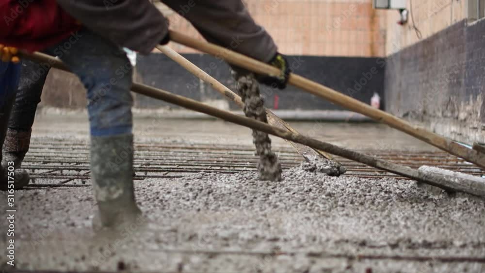 Ukraine, Kharkov, January 17. 2020, Workflow at the construction site, concrete team work pouring. Construction at the factory. Ukraine, Kharkov, January 17. 2020, Workflow at the construction site, concrete team work pouring. Construction at the factory.