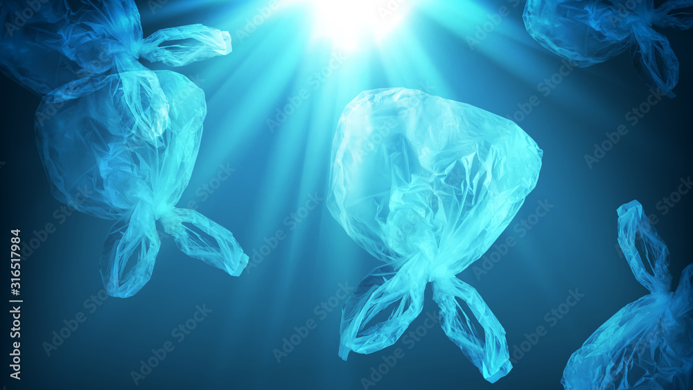 creative background of single-use transparent plastic bag in form of  jellyfish floating in sea or ocean with sunlight, many plastic bags end up  in ocean, polyethylene plastic, pollution of environment Stock Photo