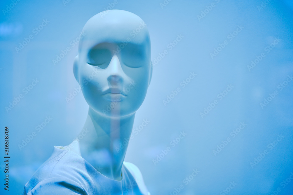 Female bust mannequin in light clothing. Color of 2020. Classic blue toned.