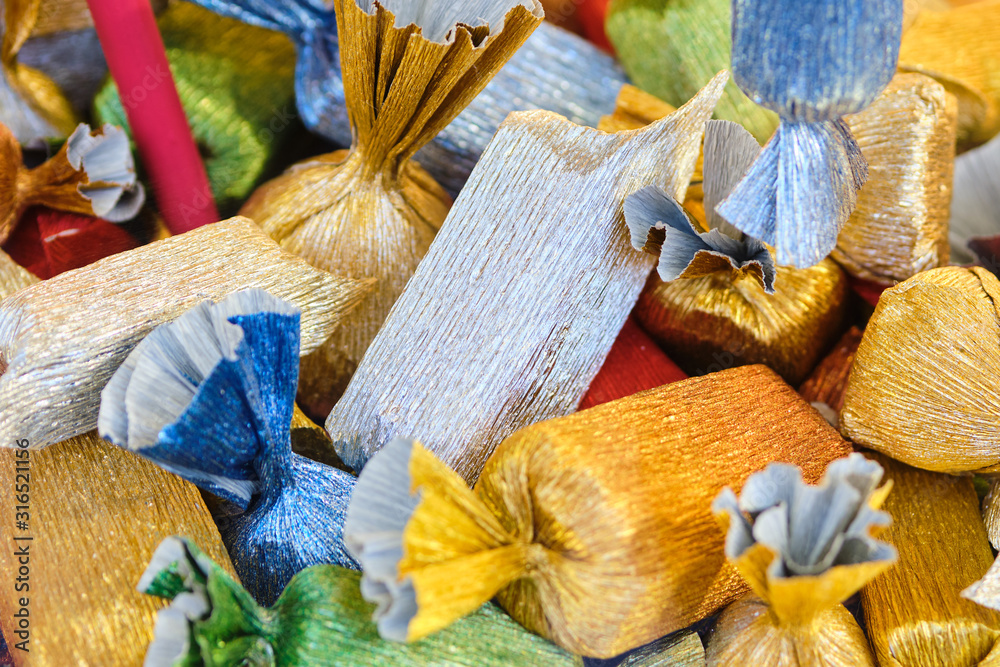 Snackcandy in shiny wrappers on the shop window. Snackcandy in shiny wrappers on the shop window.