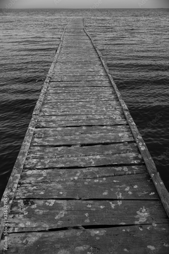 Wooden bridge to the sea..