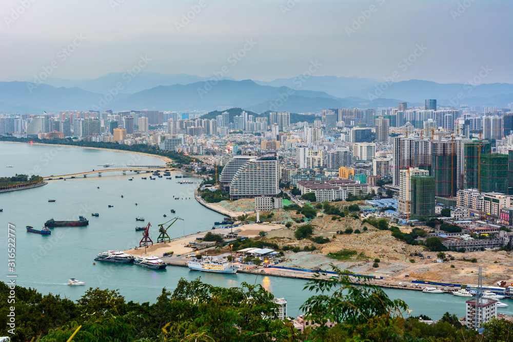 Beautiful aerial panoramic view of the city of Sanya city from Luhuitou Park. Hainan, China.
