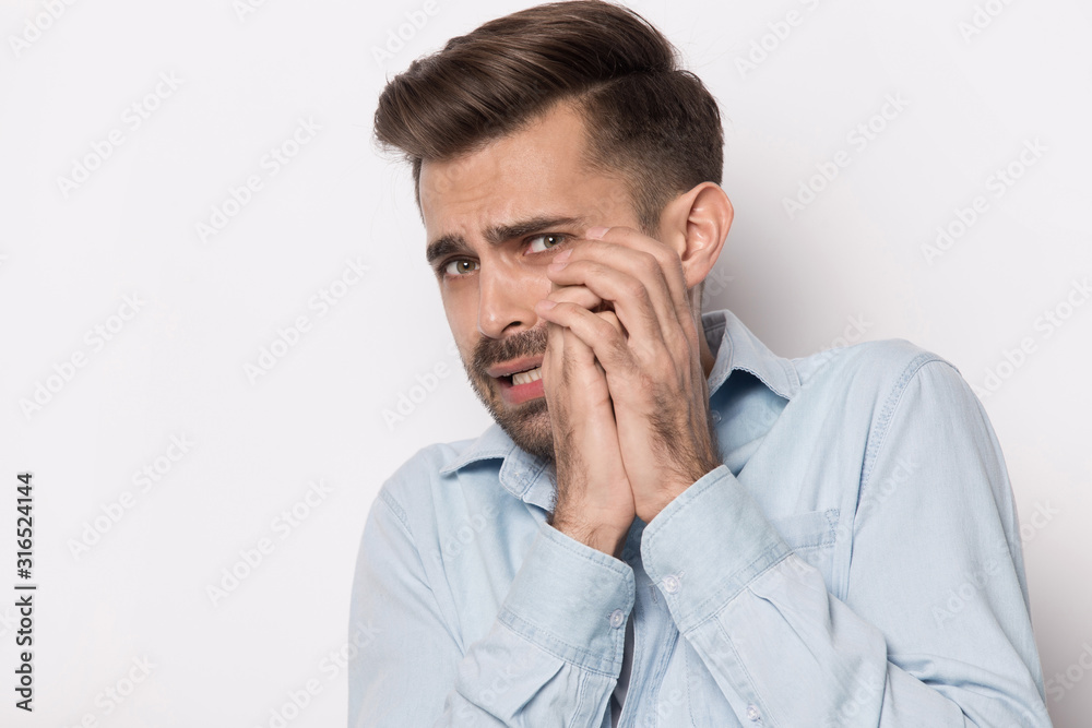 Unhappy guy feeling scare, hearing fearful terrible news. Unhappy guy feeling scare, hearing fearful terrible news.