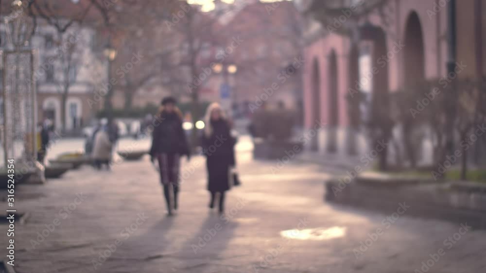 Unrecognizable people in the european city. Unrecognizable people in the european city.