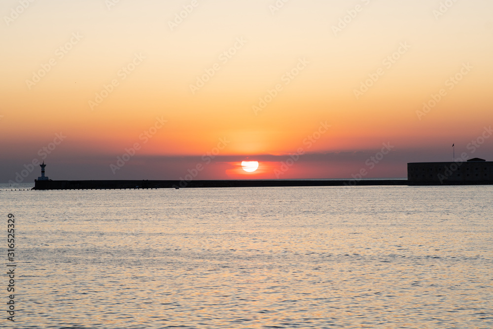 View of the embankment of Sevastopol at sunset, fiery sunset in Sevastopol, Sevastopol, Republic of Crimea