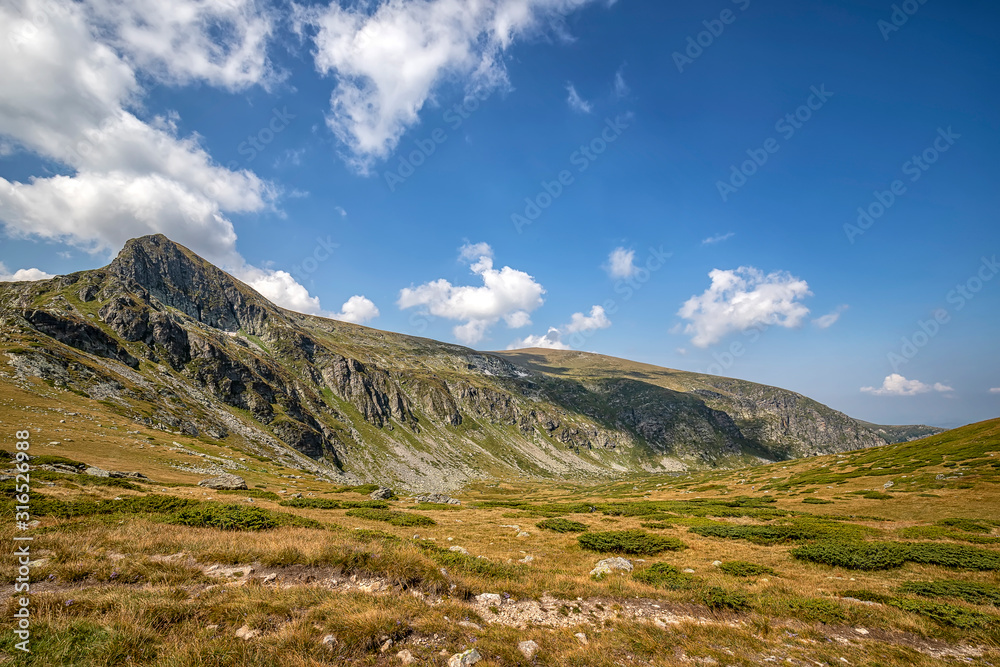 Beauty landscape of the mountain hill and clouds, Rila mountain, Bulgaria