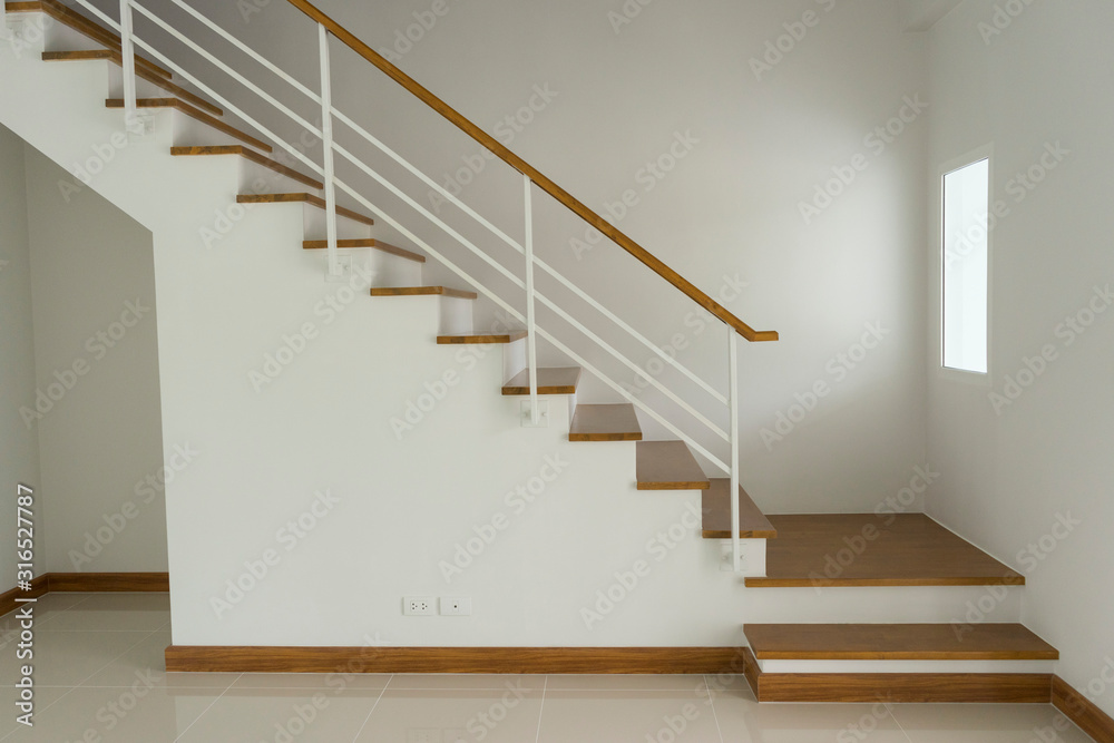 interior view of with wooden stairs elevation in house. interior view of with wooden stairs elevation in house.