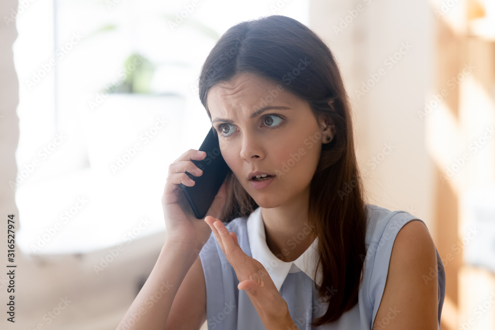 Businesswoman talking on phone with dissatisfied client solve problems distantly Businesswoman talking on phone with dissatisfied client solve problems distantly