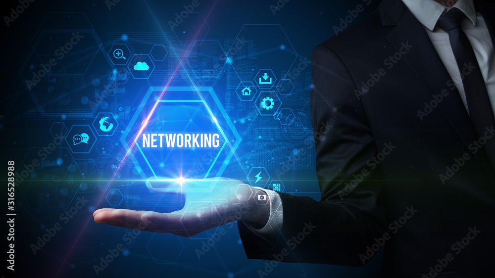 Man hand holding NETWORKING inscription, social media concept Man hand holding NETWORKING inscription, social media concept