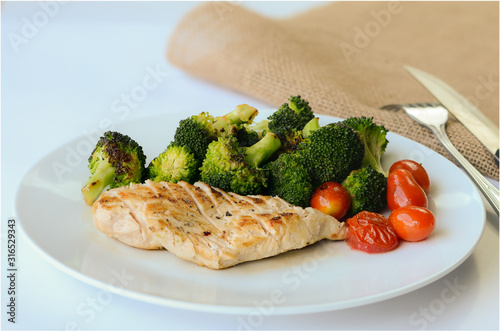 clost up grilled chicken in different vegetables. photo