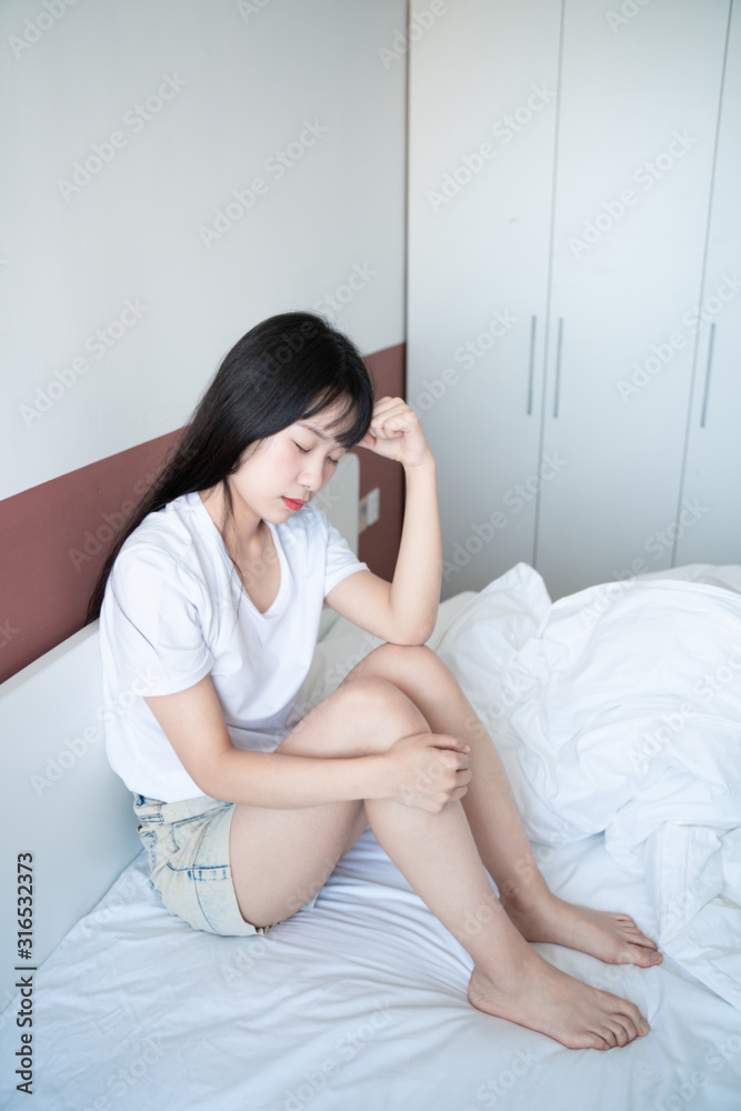 Single beautiful asian woman sad and lonely on bed Single beautiful asian woman sad and lonely on bed