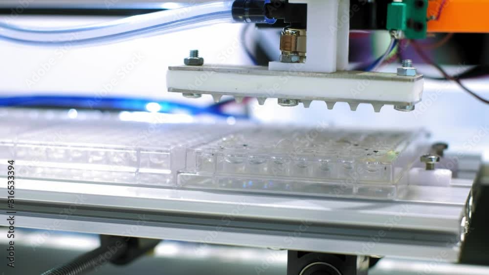 Automatic analysis of DNA. Automation in the clinical laboratory. Pipetting robot laboratory. Medicine robotics. NGS DNA diagnostics. Research and science background Automatic analysis of DNA. Automation in the clinical laboratory. Pipetting robot laboratory. Medicine robotics. NGS DNA diagnostics. Research and science background