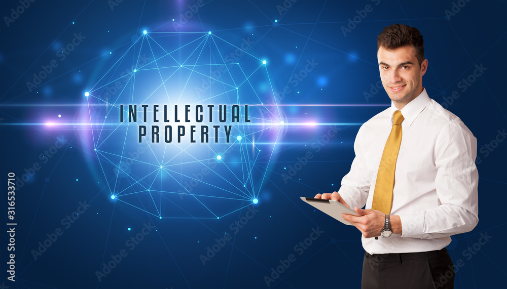 Businessman thinking about security solutions with INTELLECTUAL PROPERTY inscription