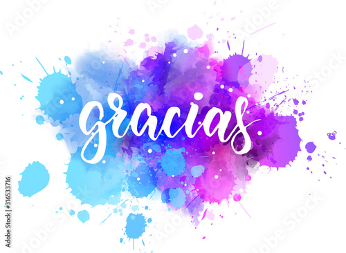 Gracias lettering on watercolor background photo