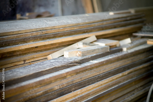 Wood working industry stack of wooden planking lath board joist table close up front view. Wood based materials.