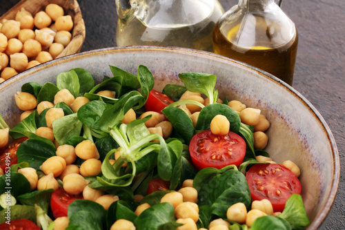 chickpea salad with ingredient and tomatoes and lamb  s lettuce. healthy salad