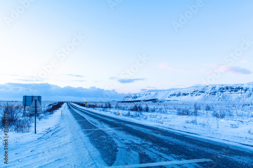 Picturesque winter landscape of Iceland. The perfect road to perspective