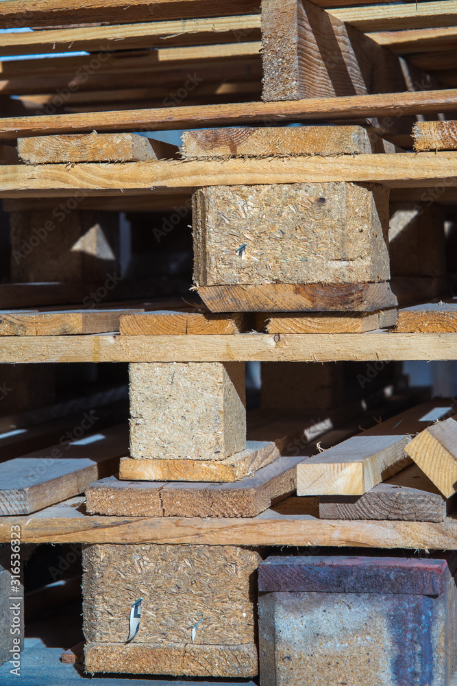 Wood working industry stack of wooden planking lath board joist table close up front view. Wood based materials. Wood working industry stack of wooden planking lath board joist table close up front view. Wood based materials.