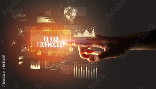 Hand touching CLOUD TECHNOLOGY inscription, new business technology concept