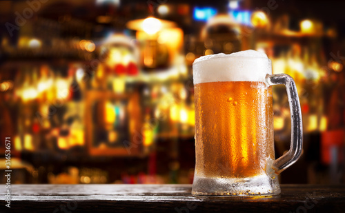 Photography cold mug of beer in a bar