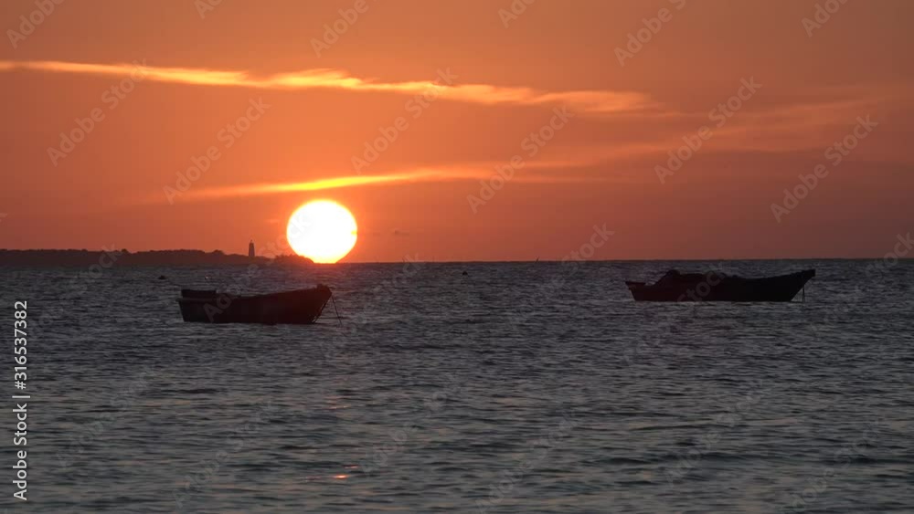 Fisherman's boat near the shore of the island of Zanzibar in the Indian Ocean. Fisherman's boat near the shore of the island of Zanzibar in the Indian Ocean.