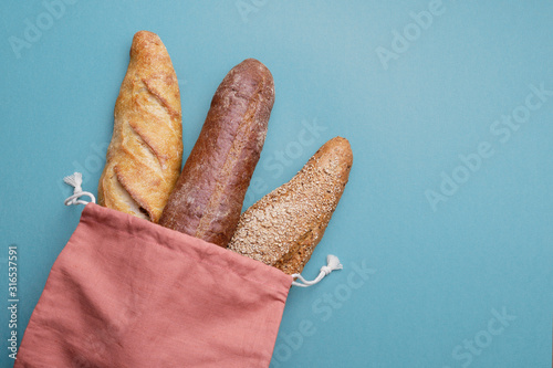 Fresh bread and baguette in cotton bag. Bakery Products. Friendl photo