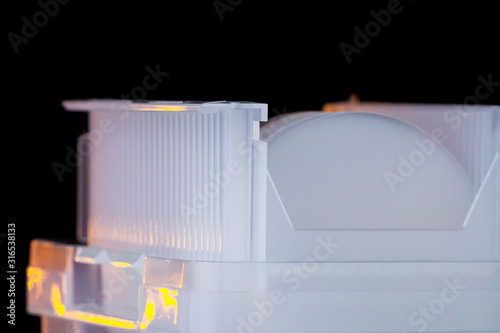 Sapphier Wafers in white plastic holder box A wafer is a thin slice of semiconductor material, used in electronics for the fabrication of integrated circuits. photo