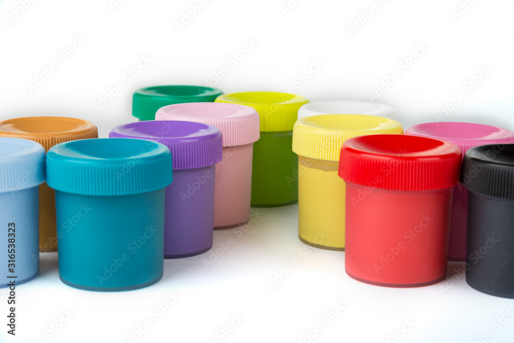 School paint in the plastic containers on a white background School paint in the plastic containers on a white background