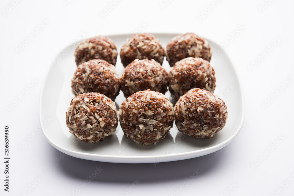 Aliv Laddu, Halim Ladoo or Garden cress Seed sweet Balls a very nutritious food in winters or for New Moms. popular food from India. served in a bowl or plate Aliv Laddu, Halim Ladoo or Garden cress Seed sweet Balls a very nutritious food in winters or for New Moms. popular food from India. served in a bowl or plate
