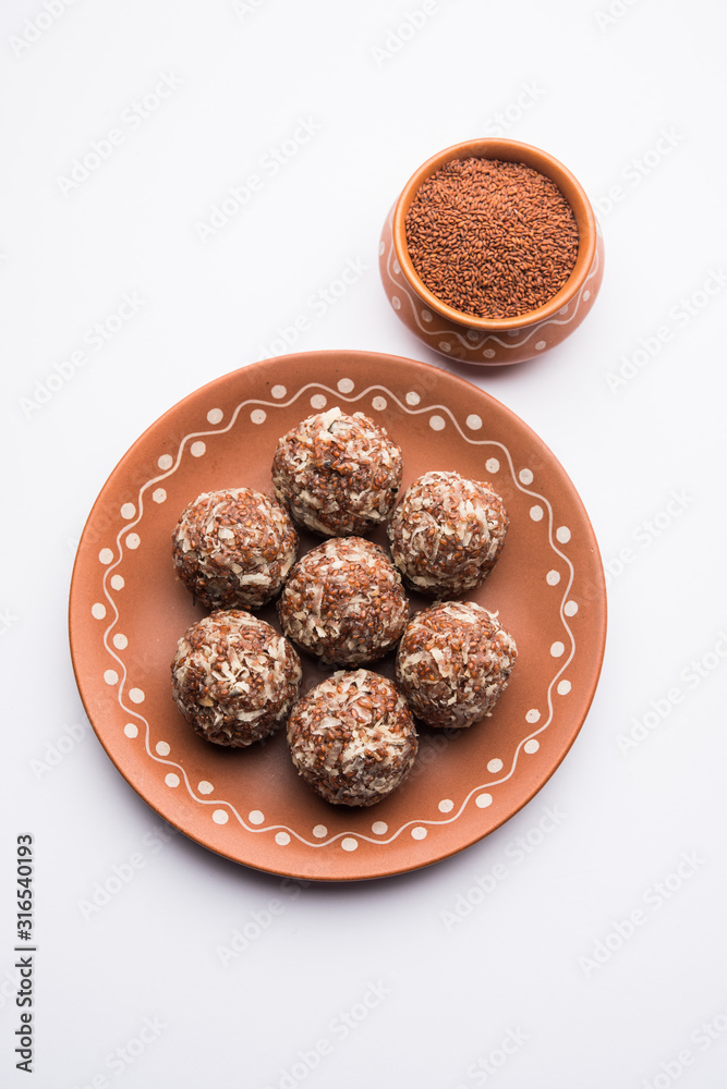 Aliv Laddu, Halim Ladoo or Garden cress Seed sweet Balls a very nutritious food in winters or for New Moms. popular food from India. served in a bowl or plate Aliv Laddu, Halim Ladoo or Garden cress Seed sweet Balls a very nutritious food in winters or for New Moms. popular food from India. served in a bowl or plate