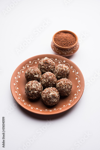 Aliv Laddu, Halim Ladoo or Garden cress Seed sweet Balls a very nutritious food in winters or for New Moms. popular food from India. served in a bowl or plate © Arundhati