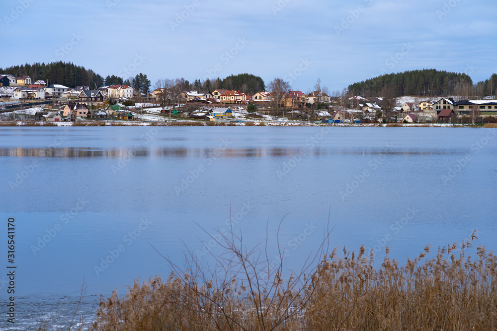 Winter nature, forest, river, village. View from above. Shooting from a copter.