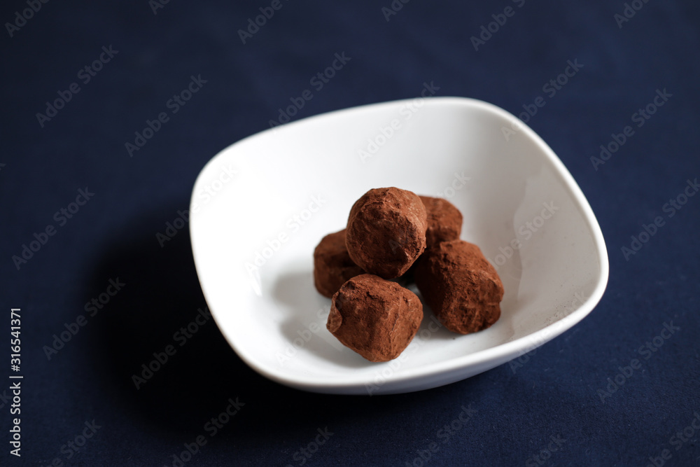chocolate truffles with cocoa on a restaurant table chocolate truffles with cocoa on a restaurant table
