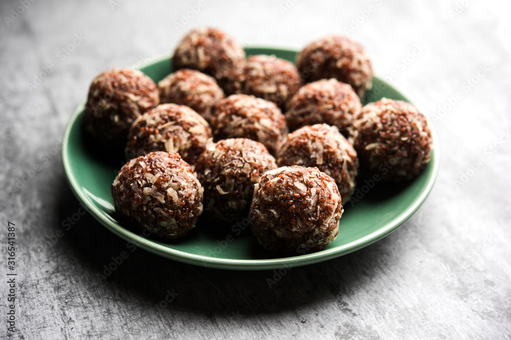 Aliv Laddu, Halim Ladoo or Garden cress Seed sweet Balls a very nutritious food in winters or for New Moms. popular food from India. served in a bowl or plate Aliv Laddu, Halim Ladoo or Garden cress Seed sweet Balls a very nutritious food in winters or for New Moms. popular food from India. served in a bowl or plate