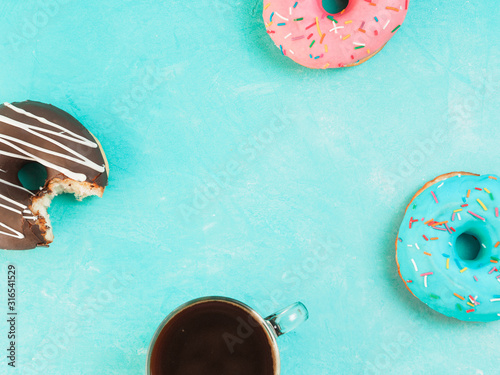 donuts on blue background , copy space, top view