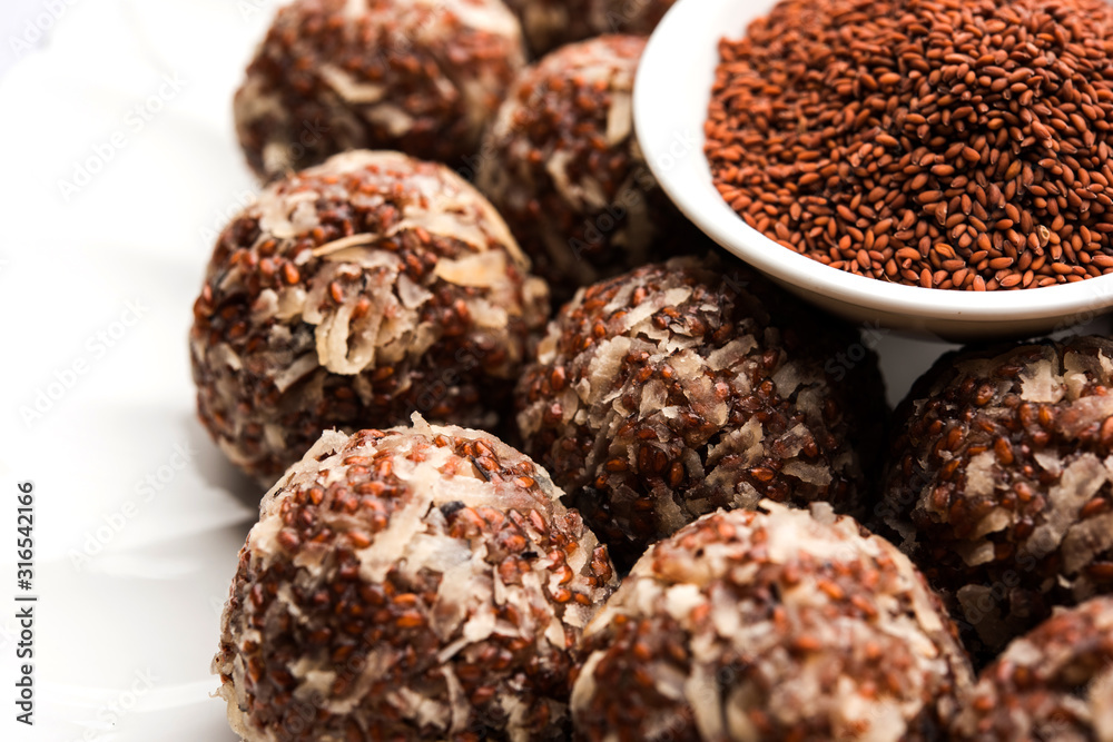 Aliv Laddu, Halim Ladoo or Garden cress Seed sweet Balls a very nutritious food in winters or for New Moms. popular food from India. served in a bowl or plate Aliv Laddu, Halim Ladoo or Garden cress Seed sweet Balls a very nutritious food in winters or for New Moms. popular food from India. served in a bowl or plate