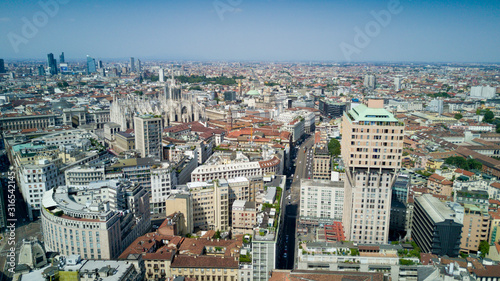 Aerial video shooting with drone on Milan Center, the central business area of the city with new skyscrapers and iconic Cathedral and square of Duomo © immaginario75