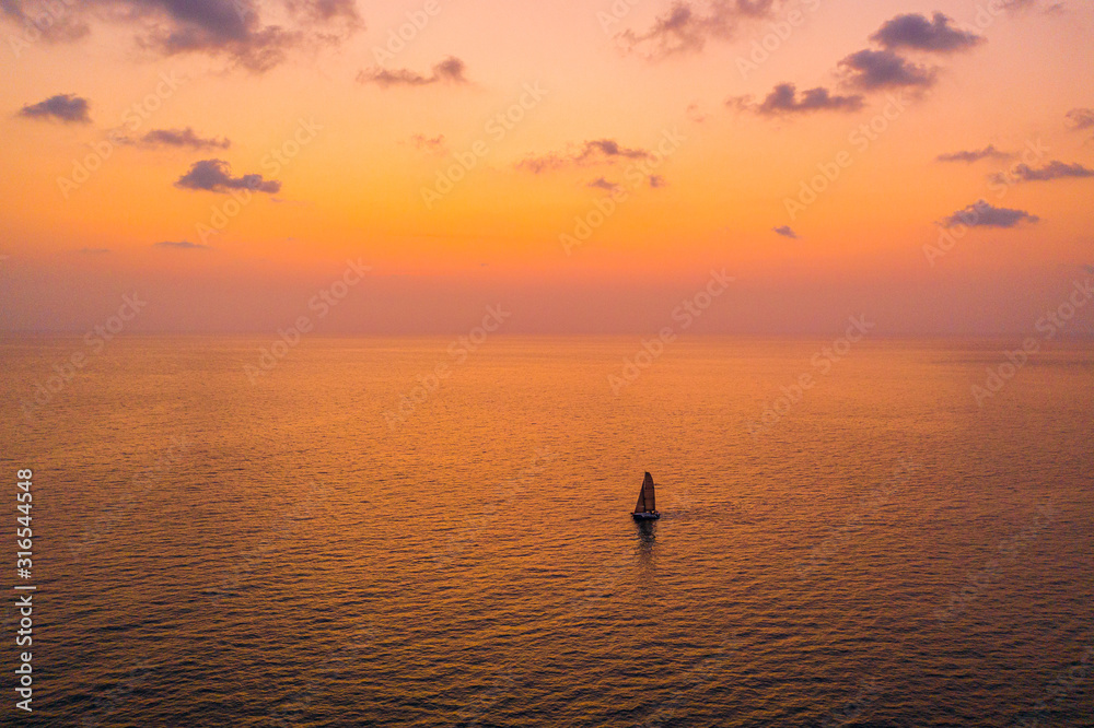 Sailing Yacht on the ocean in a beautiful sunset