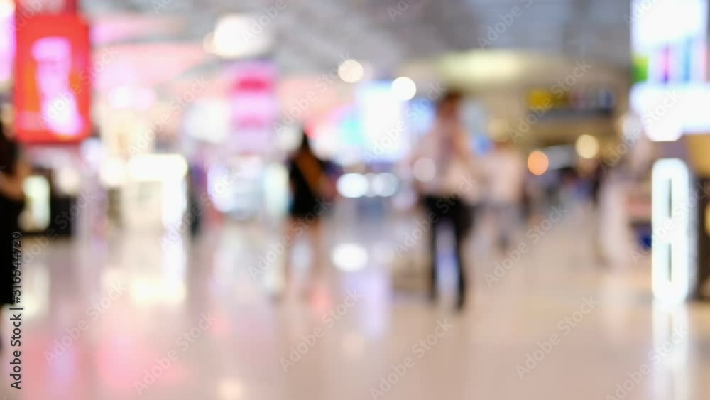 Abstract blurred image of passengers in duty free shop at the airport Abstract blurred image of passengers in duty free shop at the airport