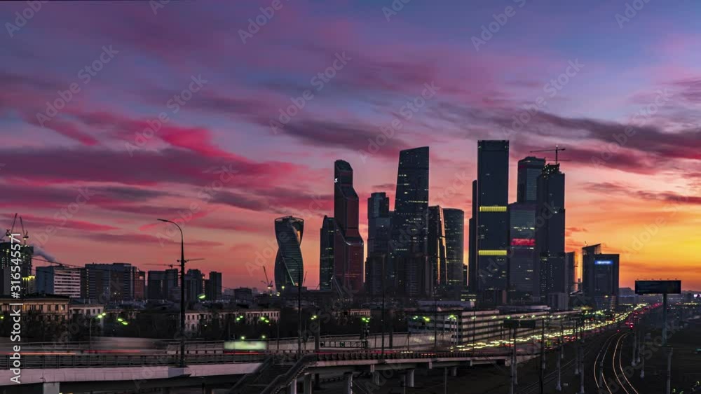view of the skyscrapers and towers of downtown at sunset, time lapse