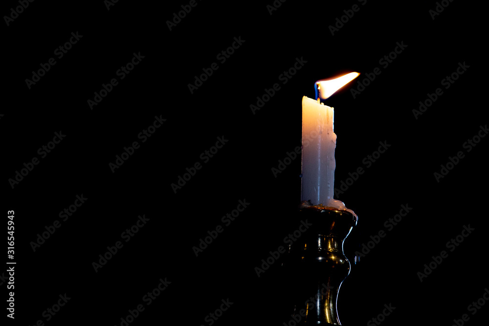 candle on black background candle on black background