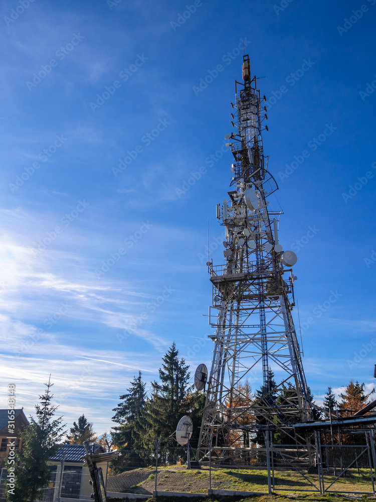 Radio Mast on Mountain top Jaworzyna Krynicka at blue sky background, Poland. Radio Mast on Mountain top Jaworzyna Krynicka at blue sky background, Poland.