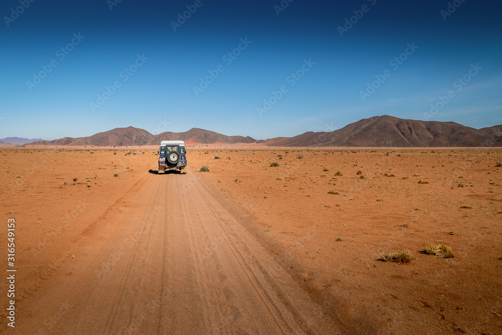 driving through the desert of namibia