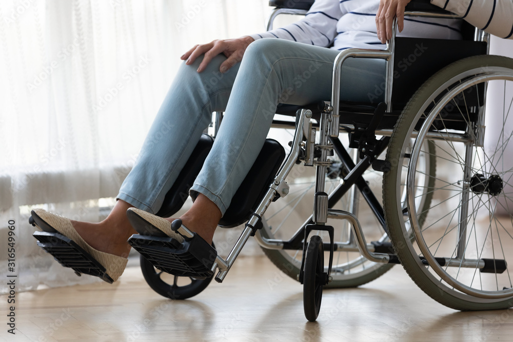Close up disabled older woman sitting in wheelchair alone Close up disabled older woman sitting in wheelchair alone
