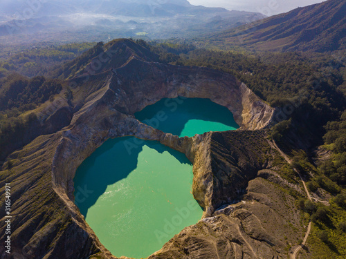 Beautiful morning aerial view of Kelimutu Crater Lakes, Moni, Flores, Indonesia. Travel photo from drone. photo